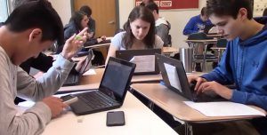 Students Using Chromebooks, Smartphones, and Calculators