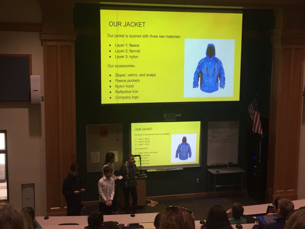students presenting an idea for a new winter jacket